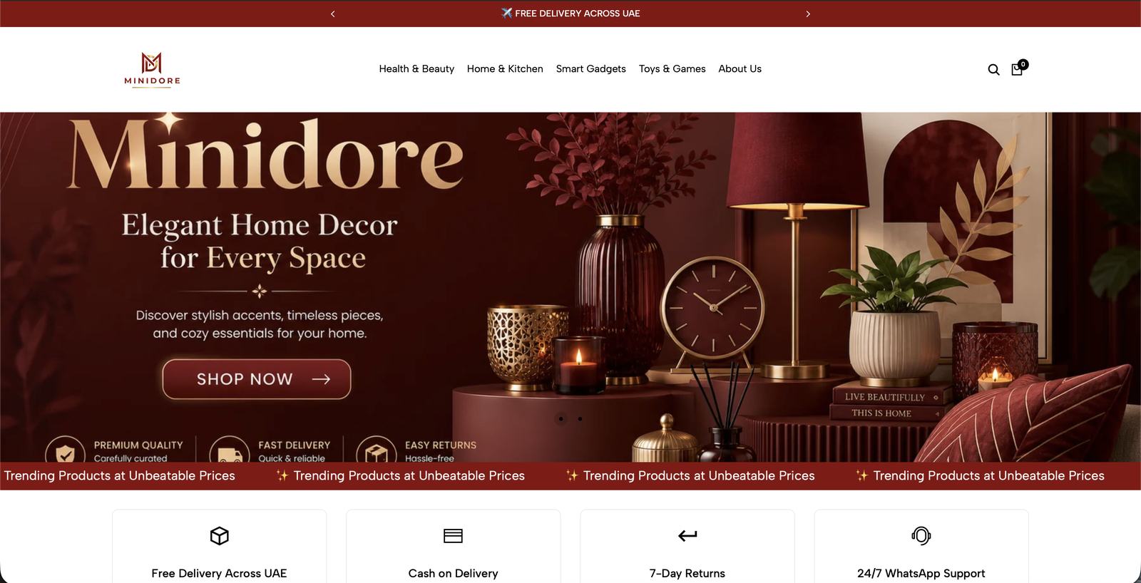 Minidore store homepage: deep red home decor hero, free UAE delivery bar and trust badges for Cash on Delivery and returns